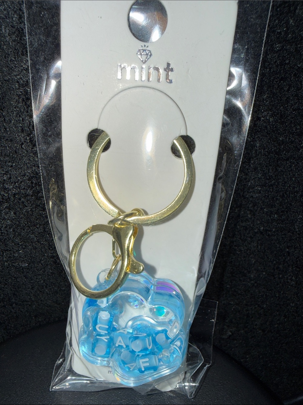 Mint gold-tone keychain with translucent blue bubble charm